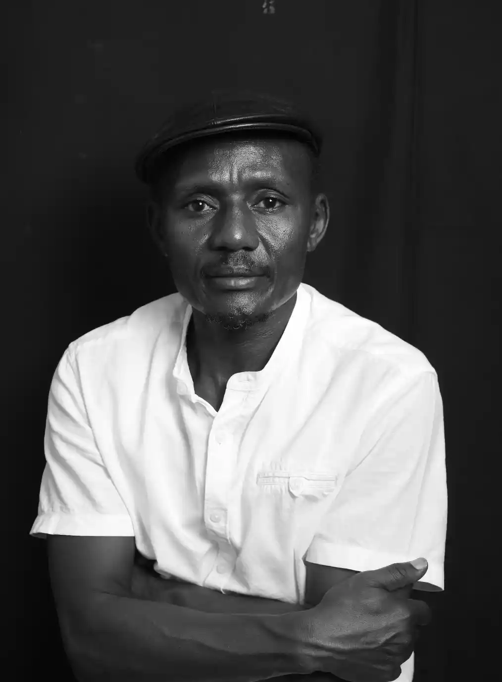 A. K. Kaiza is a Ugandan writer and former journalist. He was art and literary critic in the 1990s and early 2000s, writing for the Kenyan publication, The EastAfrican Newspaper. Starting in 2006, he has been studying Kampala the colonial and postcolonial city. He has published a number of essays on the subject. (https://debunk.media/quarterly/the-violent-birth-of-kampala/.)  His non-fiction interest also covers unreconstructed, marginal lands of the pastoralist, pre-Sahelian lands of Eastern Africa. He is currently completing a book about the city. His interest in East African cities extends beyond Kampala and covers the Indian Ocean cities of Mombasa, Zanzibar, to as far south as seafaring era Sofala, in modern day Mozambique. He is a co-founder of the writers' cooperative, Shifta Press. He currently lives in Entebbe, Uganda.